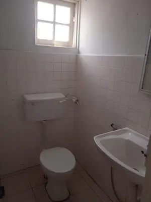 a bathroom with a toilet and a sink at Netasha Holiday INN in Tanah Rata
