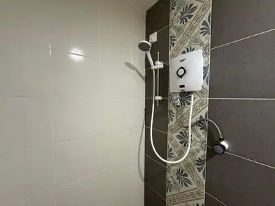 a shower with a shower head in a bathroom at Ipoh Town 3pax Suite The Anderson Residence #516 in Ipoh