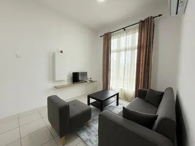 a living room with a couch and a chair at Ipoh Town 3pax Suite The Anderson Residence #516 in Ipoh