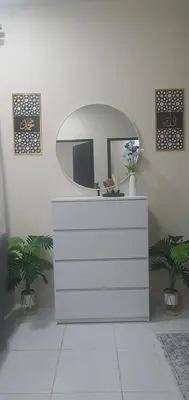a bathroom with a mirror and a white dresser at REZEKI MUEZZA 3BR2B Cozy Homestay in Teluk Intan