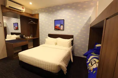 a hotel room with a bed and a bathroom at S Boutique Hotel in Ipoh
