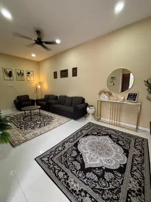 a living room with a couch and a mirror at Welcome To Amda CS Guest House