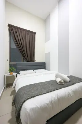 a white bedroom with a large bed with a window at Comfort Family Stay Palas Horizon Brinchang Cameron highlands -C Home Luxury A-1-03 in Brinchang