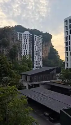 a view of a city with buildings and a mountain at 3 Bed Rooms Cozy Unit The Cove in Ipoh