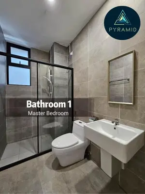 a bathroom with a white toilet and a sink at 3 Bed Rooms Cozy Unit The Cove in Ipoh