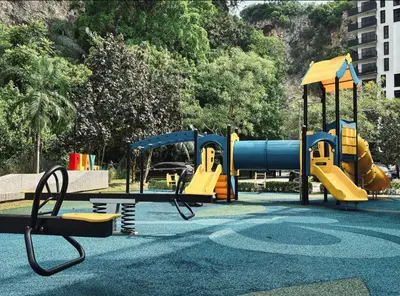 a park with a playground with a slide at Ipoh The Cove Hillside Premier Suites By LUX SUITE in Ipoh