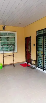 a room with two chairs and a window and a door at ANAS Inn Homestay Balik Pulau, Penang in Balik Pulau