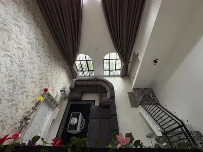 an overhead view of a living room with a couch and stairs at Luxury House Panoramic Views and Elegant Comfort in Batu Gajah