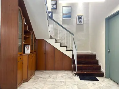 a hallway with a staircase in a building at Bagan Cozy Family Retreat 4BR 10 Pax in Butterworth