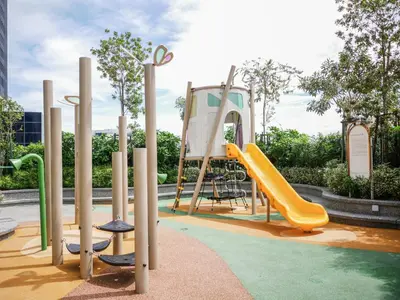 a playground with a yellow slide and a slideintend at 22 Macalisterz by Mana Mana in George Town