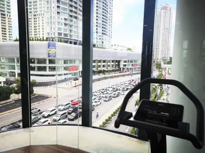 a room with a view of a parking lot at Premier Suite Seaview 3 minute to gurney in Gua Sai