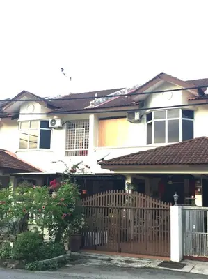 a house with a wooden fence in front of it at Cozy Home near Airport, & Bayan Lepas Industrial in Bayan Lepas