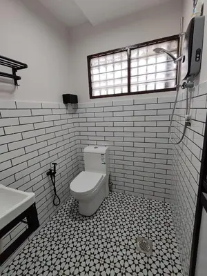 a bathroom with a toilet and a sink and a window at Tambun - Near LWOT, PLUS Highway Access ,Sunway & Pantai Hosp in Tambun