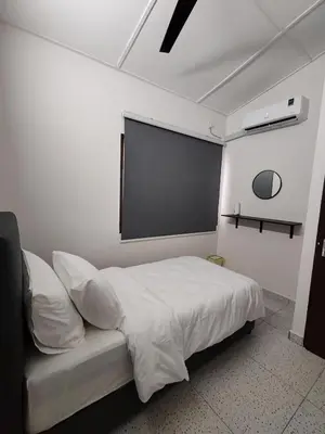 a bedroom with a bed and a projection screen at Tambun - Near LWOT, PLUS Highway Access ,Sunway & Pantai Hosp in Tambun