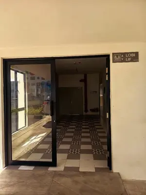 an entrance to a building with a glass door at IFS Soho 3 Basic Home in Seri Iskandar