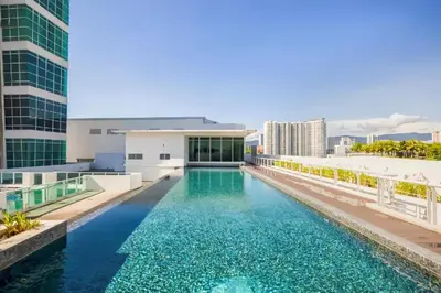 a swimming pool on the roof of a building at 2BR Maritime Suite Duplex George Town SeaView in George Town