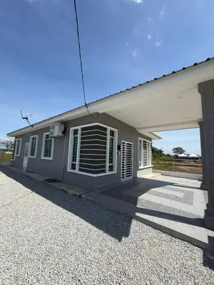 a small house with a window and a garage at Adlisem Homestay in Kampong Lahar Yooi