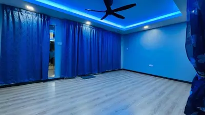 a blue room with a ceiling fan and blue curtains at Homestay, Lunas Kulim near BKE highway with 3 spacious rooms and fully furnished in Lunas