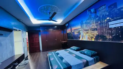 a bedroom with a bed and a painting on the wall at Homestay, Lunas Kulim near BKE highway with 3 spacious rooms and fully furnished in Lunas