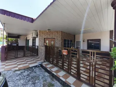 a house with a wooden fence and a porch at Dreamy Stay Penang in Butterworth