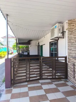 a porch of a house with a wooden fence at Dreamy Stay Penang in Butterworth