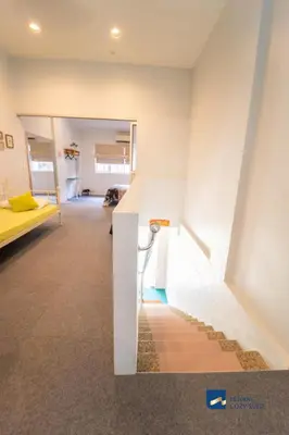 a room with a white wall and a yellow couch at Cozy Nanny House 2-6Pax #Georgetown #Hameediyah in George Town