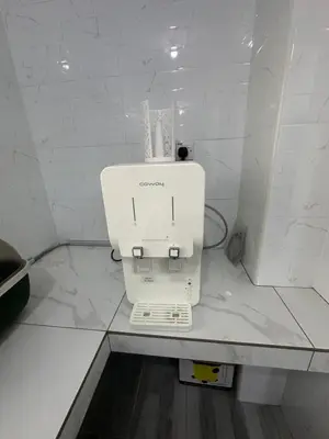 a white machine sitting on a counter in a room at MRB Homestay in Ipoh