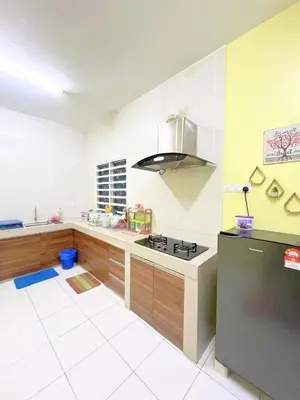 a kitchen with a stove and a counter top at THE QUINTET BY D Atas Bukit Antarium in Tanah Rata