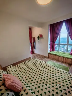 a bedroom with a bed and a large window at ZE Emerald Avenue,Brinchang in Brinchang