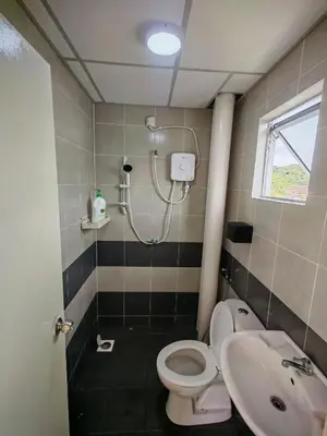 a bathroom with a shower and a toilet and a sink at ZE Emerald Avenue,Brinchang in Brinchang