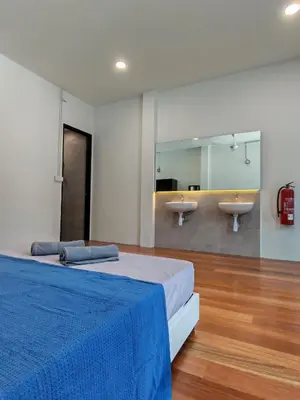 a bedroom with two beds and two sinks at Pets Friendly Hometstay at Georgetown Heritage in George Town