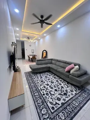 a living room with a couch and a table at Homestay Yunaz in Kampong Banggol Pasir