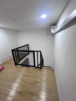 a room with a black object on the wall at Homestay Yunaz in Kampong Banggol Pasir