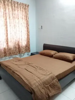 a bed sitting in a room with a window at NORDIAZZ Home in Ipoh