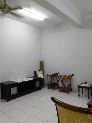 a white room with two chairs and a table at NORDIAZZ Home in Ipoh