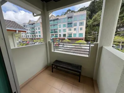 a balcony with a bench and a building at Rumah by Abg K in Cameron Highlands in Tanah Rata