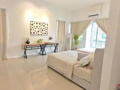 a bedroom with a bed and a desk in it at 16 Paxx Mountain Joy Corner Villa with KTV Pool BBQ in Ipoh