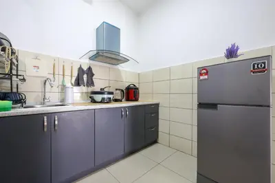 a kitchen with a refrigerator and a sink at Top 3 Homestay Palas Horizon Brinchang Cameron Highland -C Home Luxury A-3-18 in Brinchang