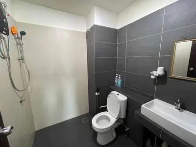 a bathroom with a toilet and a sink at GR studio APARTMENT 2 - kompleks MUTIARA gua MUSANG in Gua Musang