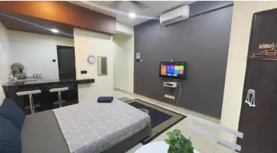 a room with a bed and a tv in it at GR studio APARTMENT 3 - kompleks MUTIARA gua MUSANG in Gua Musang