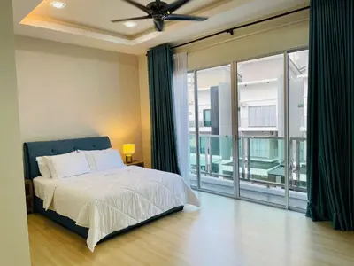 a bedroom with a bed and a large window at The Grand Crystal Retreat 4-Bedroom Luxury Villa in Taiping