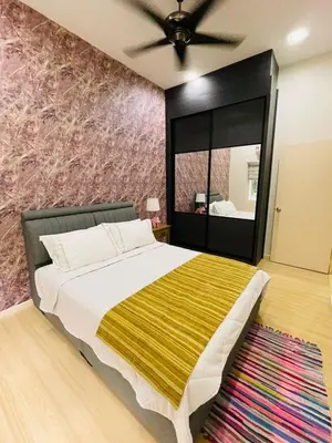 a bedroom with a bed and a large mirror at The Grand Crystal Retreat 4-Bedroom Luxury Villa in Taiping