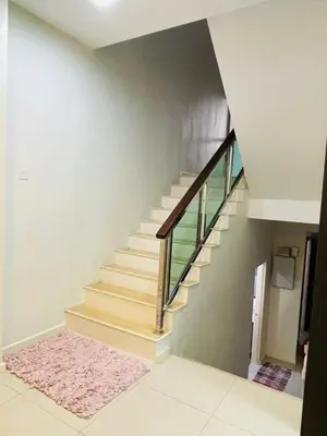 a staircase in a house with a pink rug at The Grand Crystal Retreat 4-Bedroom Luxury Villa in Taiping