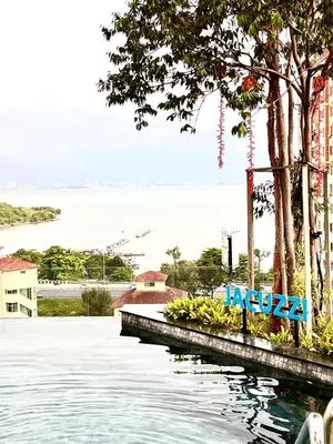 a view of a body of water with trees and bananas at The Urban Suites City&seaview in Jelutong