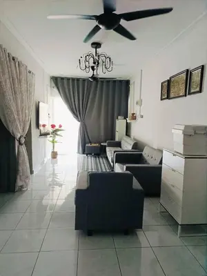 a living room with a couch and a ceiling fan at AR Homestay SP TRJ in Sungai Petani