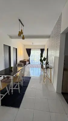 a dining room and living room with a table and chairs at DADDY HOMES 4 EMERALD AVENUE CENTRUM Brinchang View in Brinchang