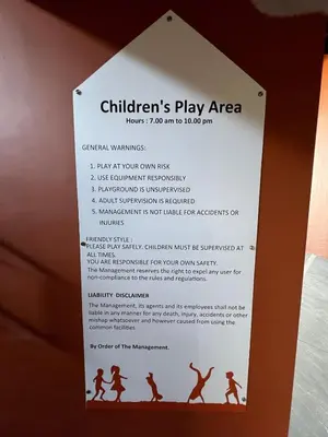 a sign for a childrens play area at Modern Two Bedroom Ipoh City Apartment with Pool, Gym and Free Parking in Ipoh