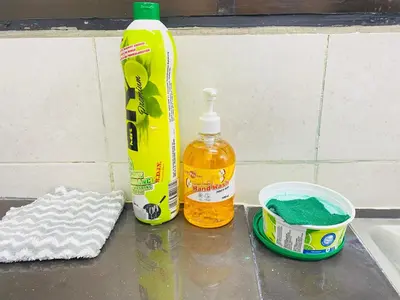 a sink with a bottle of soap and a sponge at Homestay Sayang in Ipoh