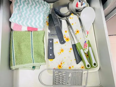 a drawer filled with kitchen utensils on a counter at Homestay Sayang in Ipoh