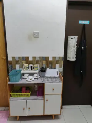 a toy kitchen with a counter and a sink at Seri Homestay Apartment Seri Iskandar in Seri Iskandar